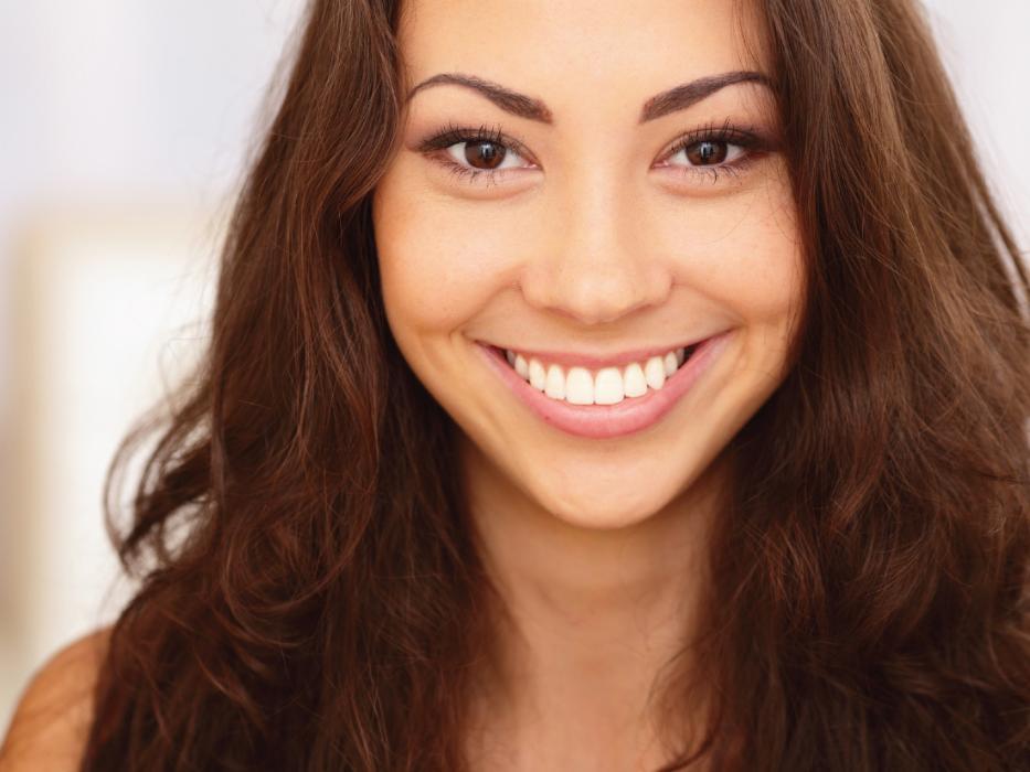 woman smiling with dental crowns in charlotte nc