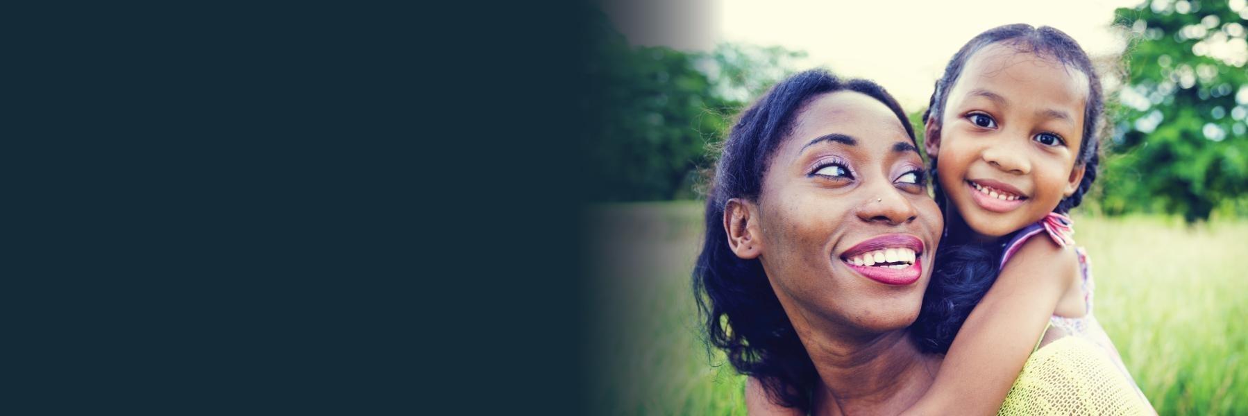 mother smiling after professional teeth whitening in charlotte nc