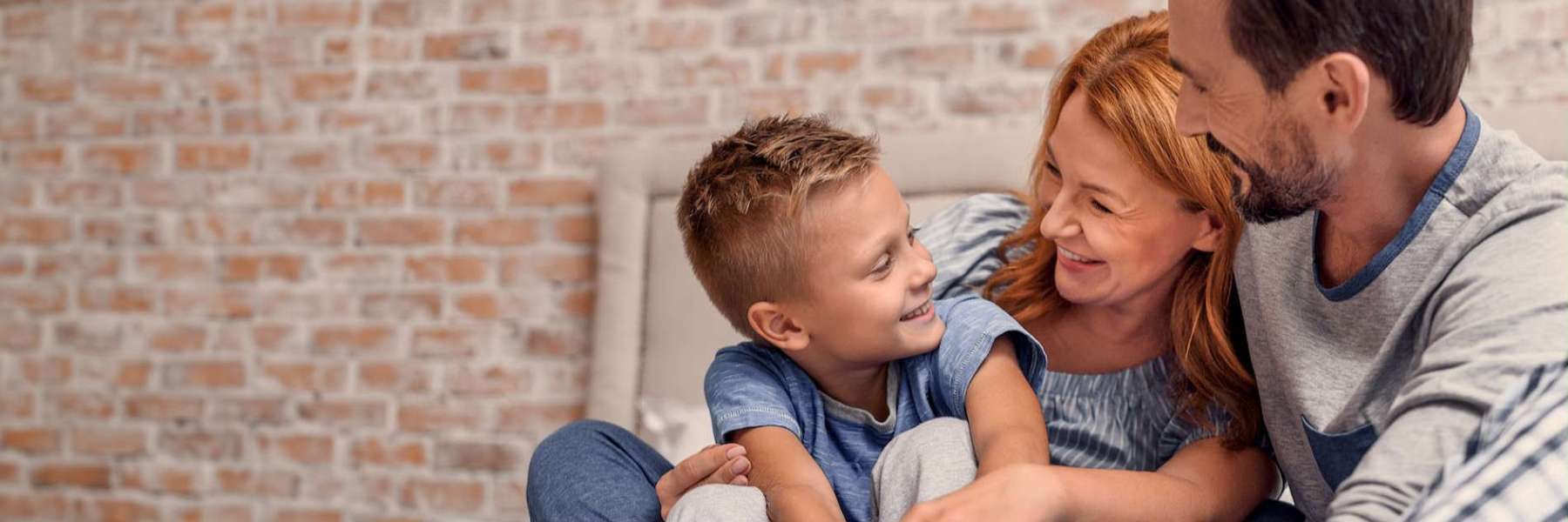 Mom and dad with son smiling, charlotte nc