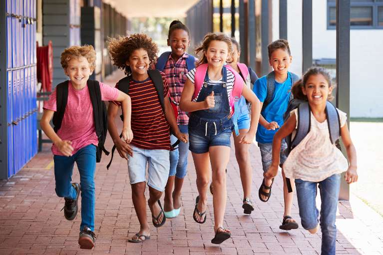 Kids running outside of a school, charlotte nc