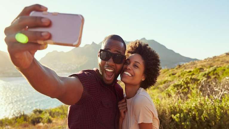 Black man and woman taking a selfie, charlotte nc