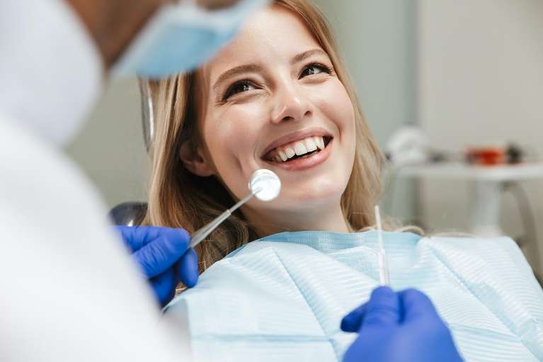 Woman in dental chair smiling, charlotte nc