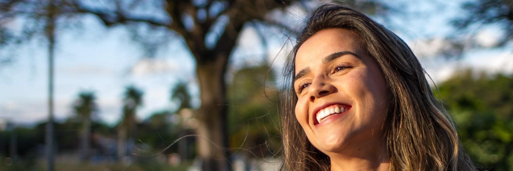 girl smiling with dental implants in charlotte nc