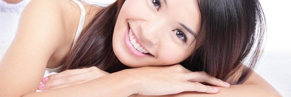 girl with dental implants in charlotte nc